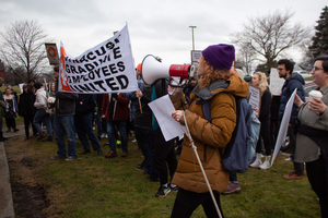 Social Science Ph.D. student Alex Scrivner leads chants during Thursday morning’s  bargaining rally held by Syracuse Graduate Employees United. Members of SGEU gathered on 621 Skytop Rd prior to its bargaining committee’s all-day session with the university.